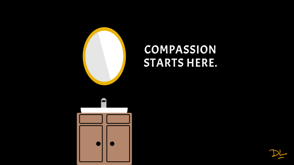Bathroom mirror with sink below it. Text to the right of the mirror that reads "Compassion starts here."